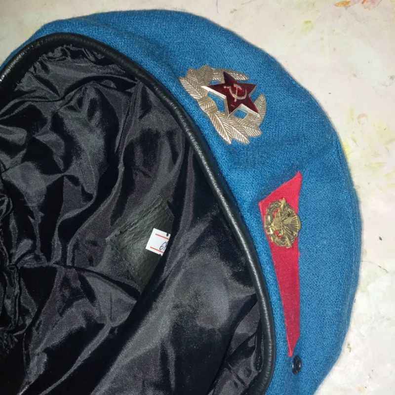 Interior detail of Soviet Airborne blue beret with original military badges