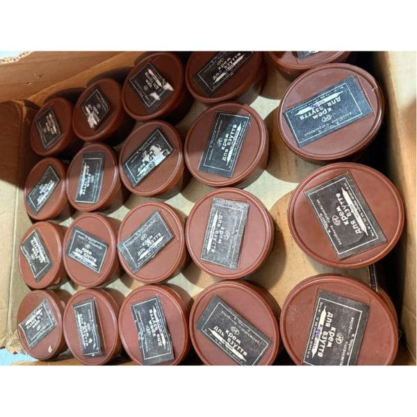 Bulk Soviet military boot polish tins stored in warehouse, Afghan War era
