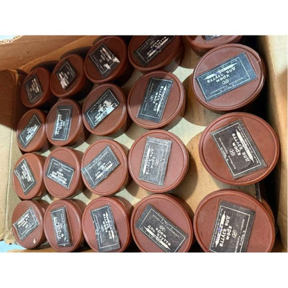 Bulk Soviet military boot polish tins stored in warehouse, Afghan War era