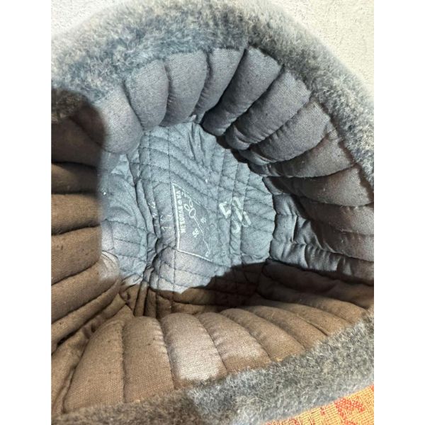 Soviet military ushanka worn with ear flaps down for cold weather
