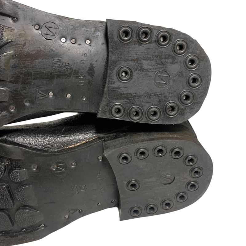 Close-up of the rubber heels and sole markings on Soviet VDV kirza boots in size 46.