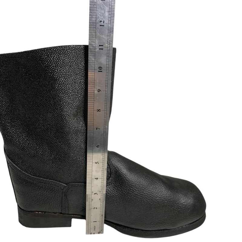 Side view of a black Soviet VDV kirza boot in size 46 with a ruler showing its height in centimetres.