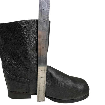 Side view of a black Soviet VDV kirza boot in size 46 with a ruler showing its height in centimetres.