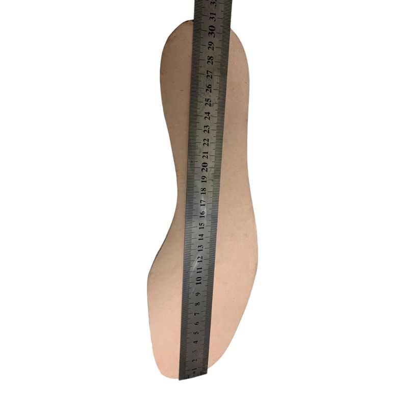 Side view of a black Soviet VDV kirza boot in size 46 with a ruler showing its height in inches.