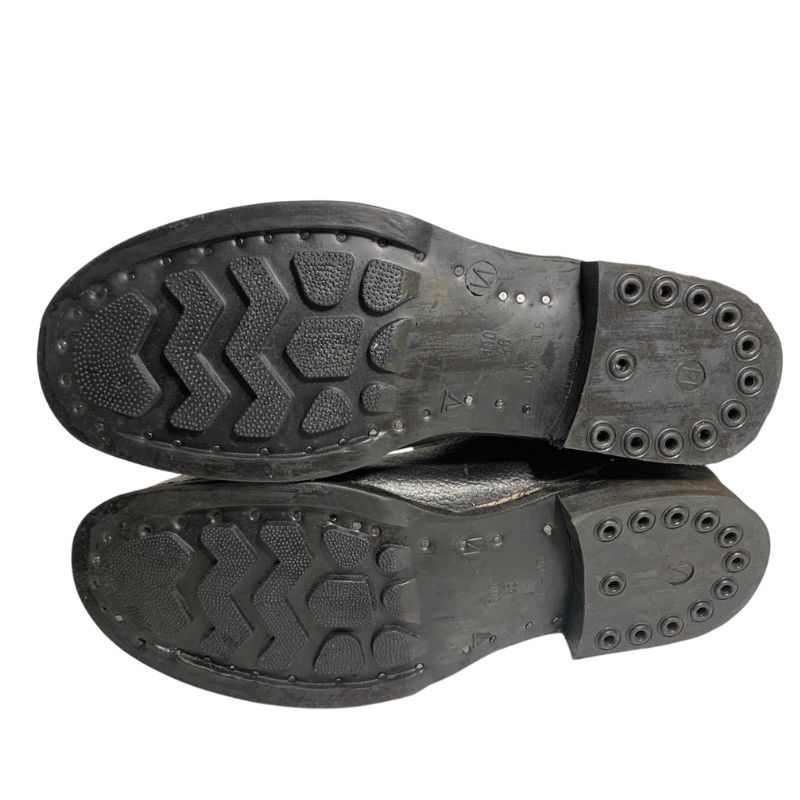 Bottom view of Soviet VDV kirza boots in size 46, showing both rubber soles and tread patterns.