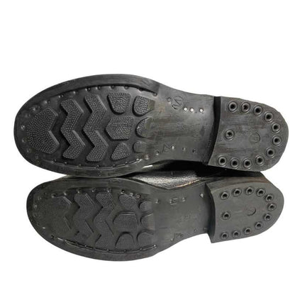 Bottom view of Soviet VDV kirza boots in size 46, showing both rubber soles and tread patterns.