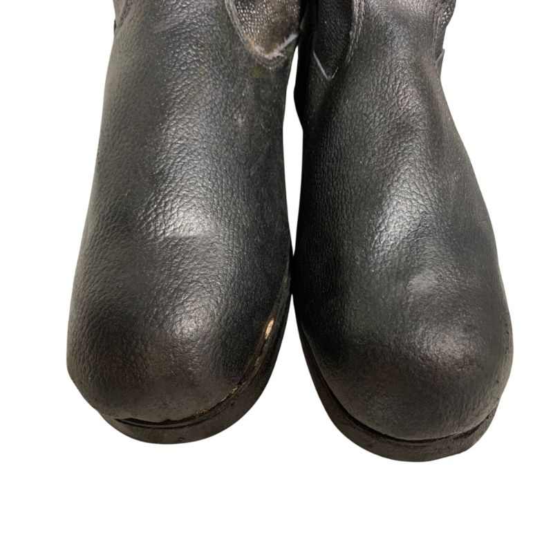 Close-up of the rounded toes and textured uppers of Soviet VDV kirza boots in size 46.