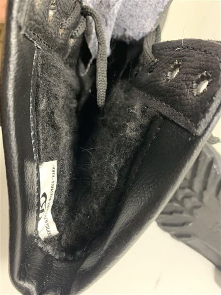 Side angle of Soviet winter combat boots black leather military footwear