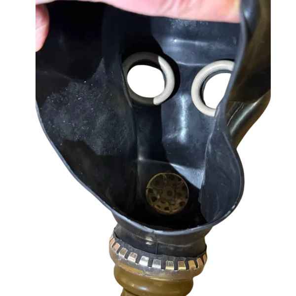 Original USSR ShMS black gas mask three-quarter view showing rubber construction and side details.
