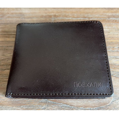 Back side of the Yuri Gagarin vintage leather wallet with embossed Poyekhali inscription
